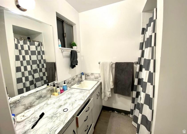 640 East 600 North Logan, UT 84321 - Photo 18 of 20 Full bath with vanity and a shower with shower curtain