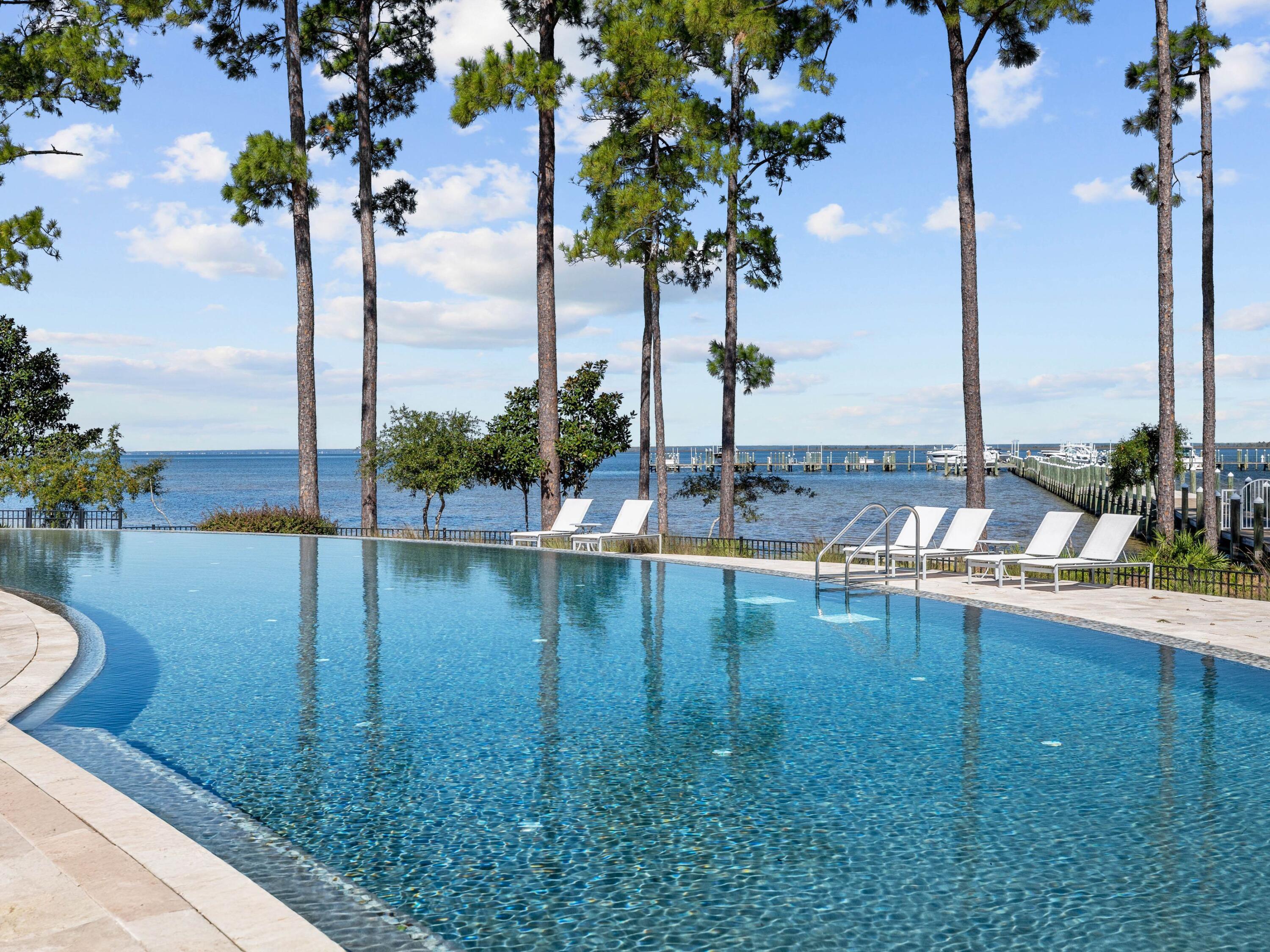 Lot 44 Perrin Santa Rosa Beach Santa Rosa Beach, FL 32459 - Photo 14 of 15 a view of a swimming pool with a lawn chairs and lake view