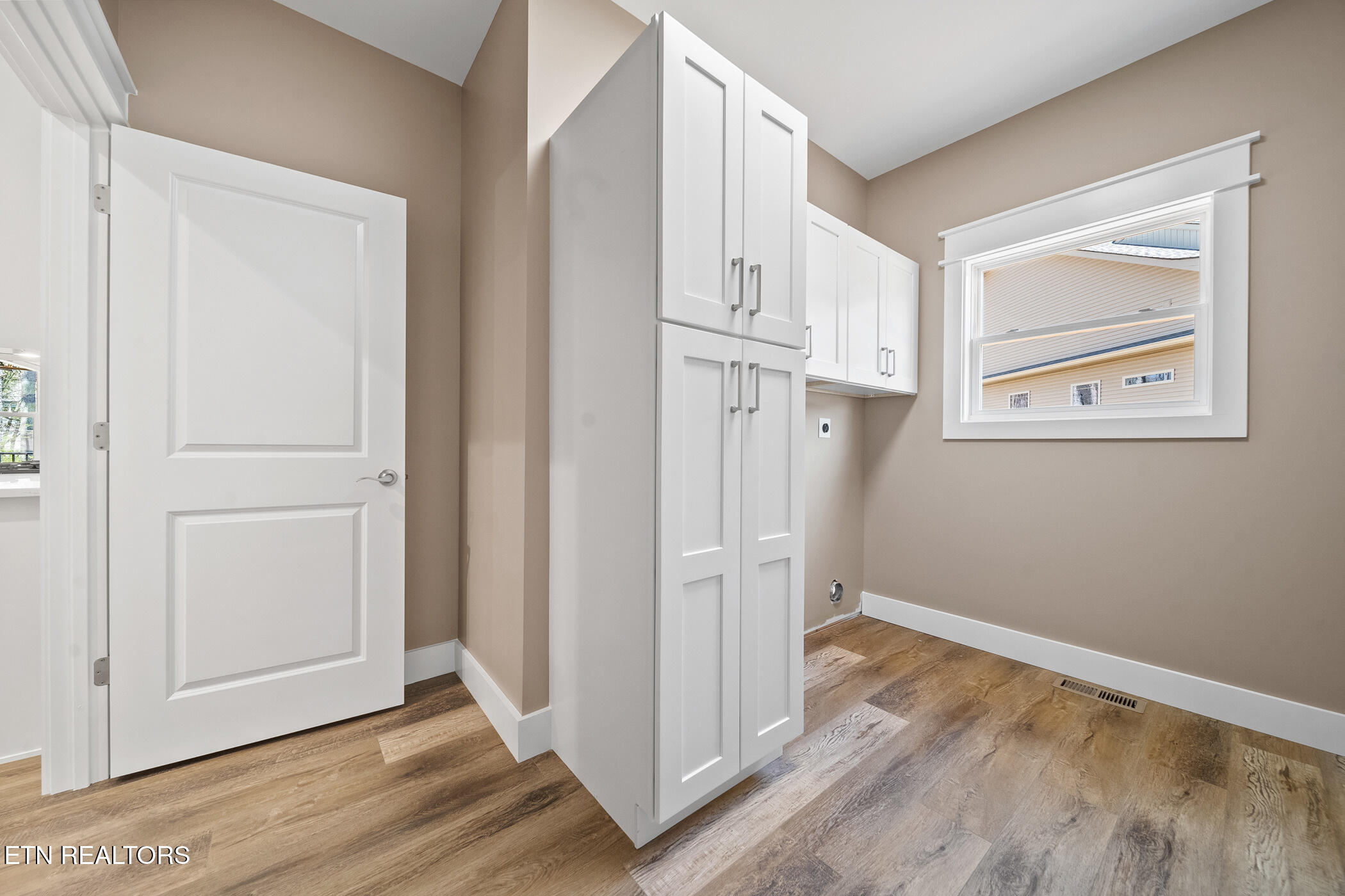 214 Cheeyo Trace Loudon, TN 37774 - Photo 27 of 42 laundry room with custom cabinetry