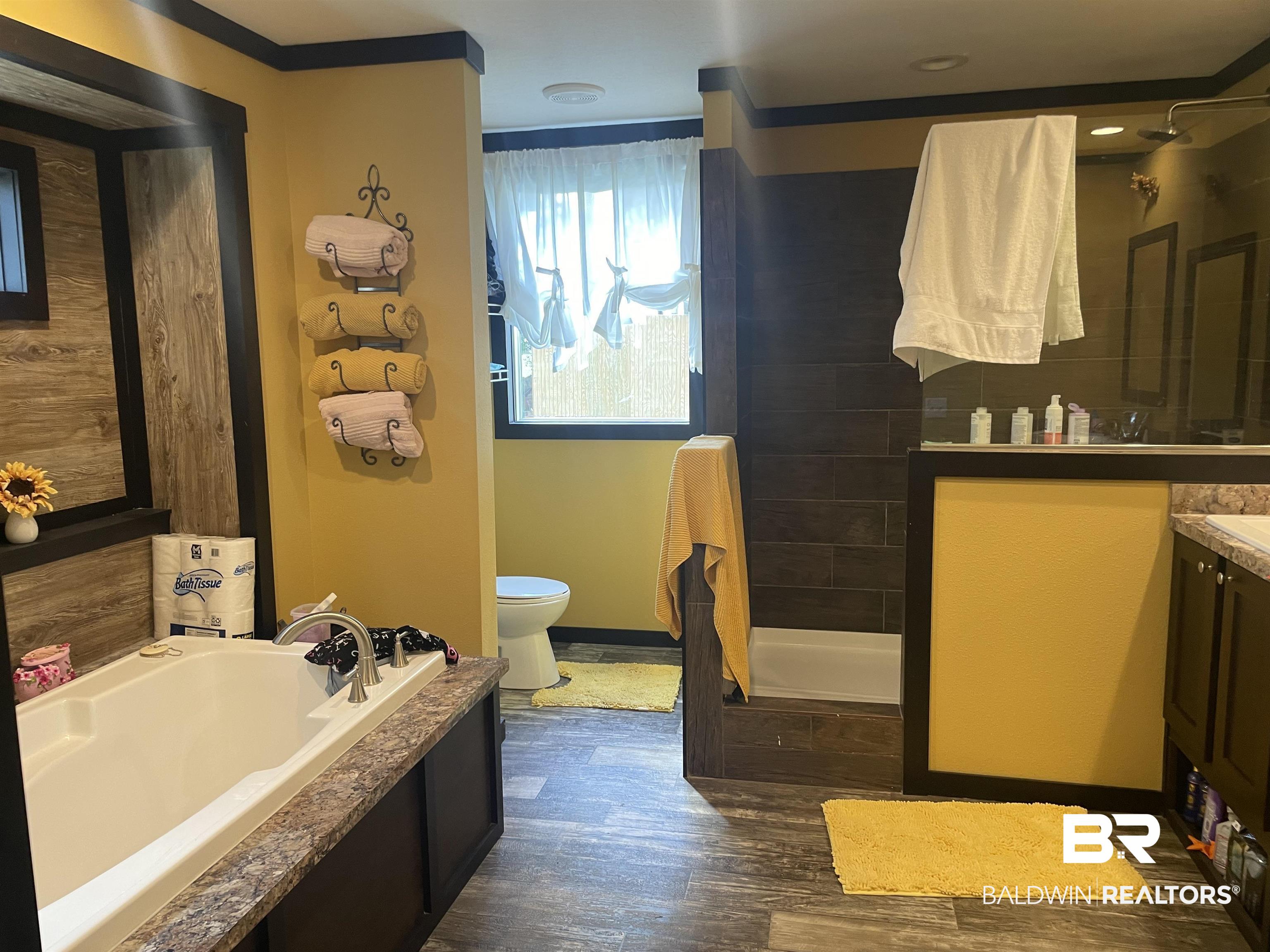 21593 Hubbard Road Robertsdale, AL 36567 - Photo 8 of 22 Full bath with a bath, tiled shower, toilet, and wood finished floors