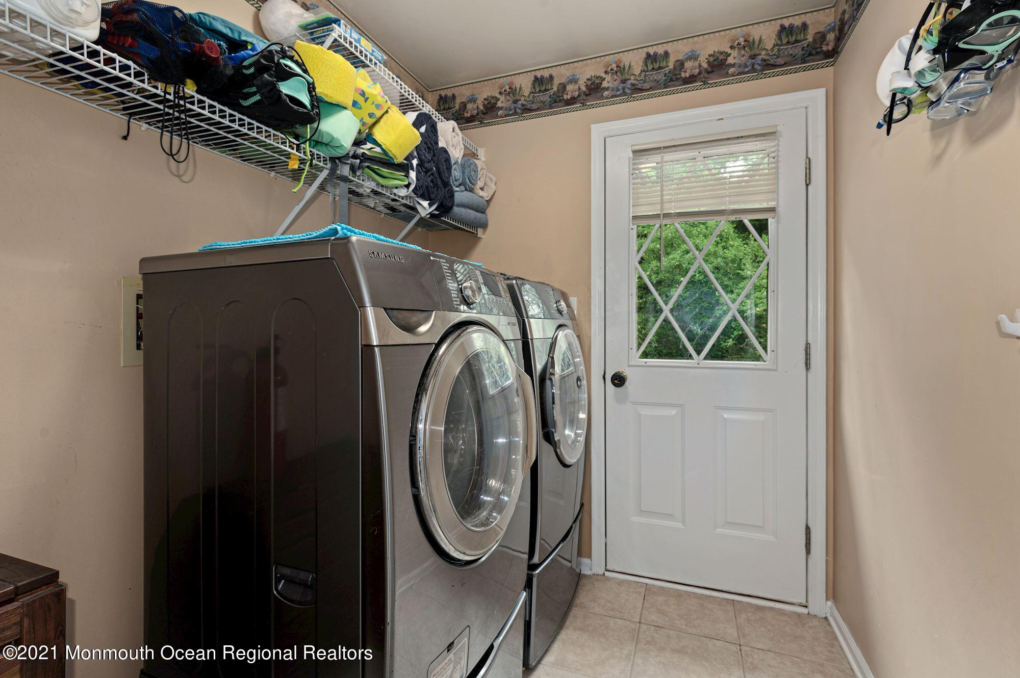 256 Nottingham Road Morganville, NJ 07751 - Photo 14 of 41 a utility room with dryer and washer