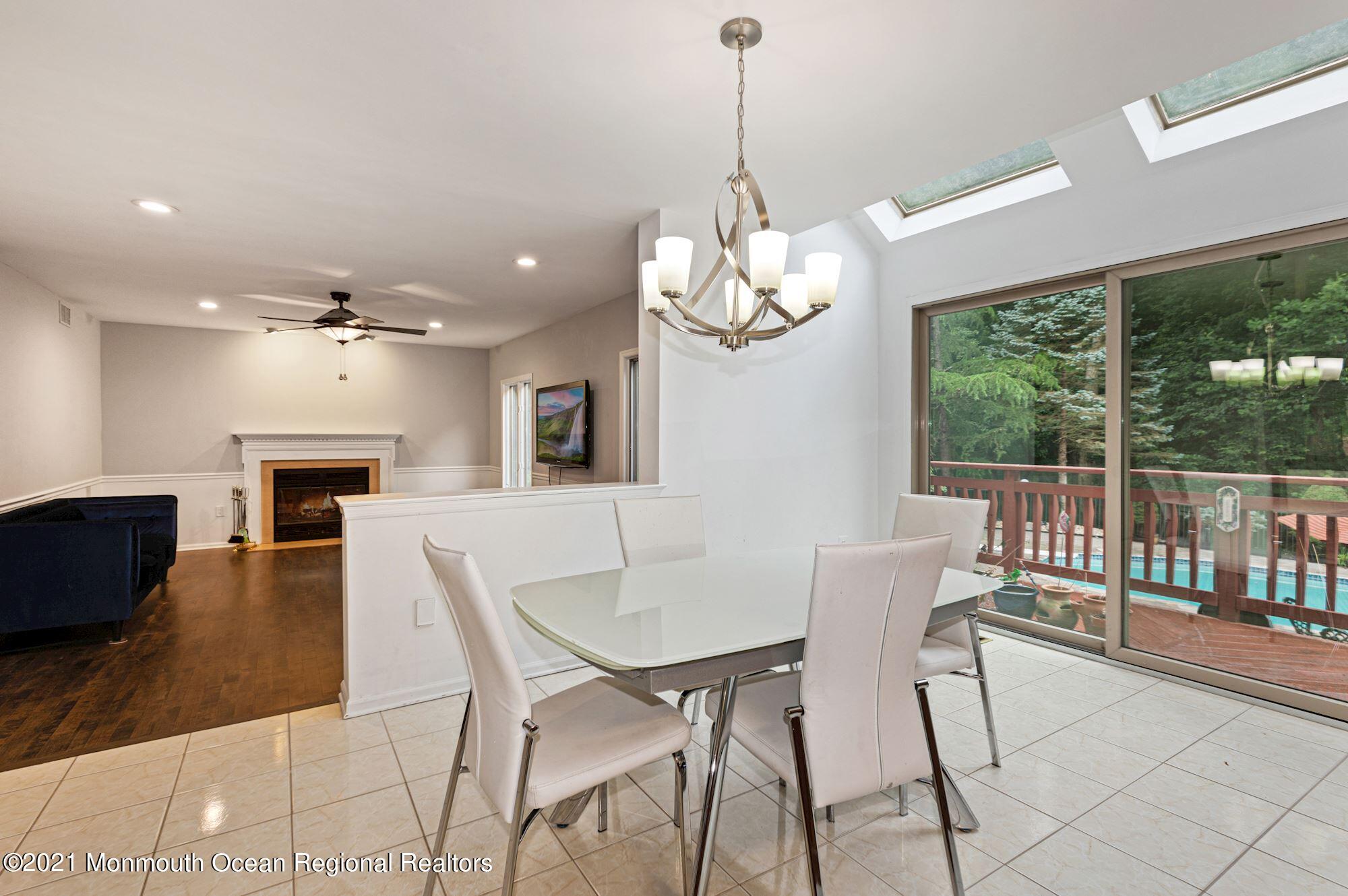 256 Nottingham Road Morganville, NJ 07751 - Photo 3 of 41 a view of a dining room with furniture window and outside view