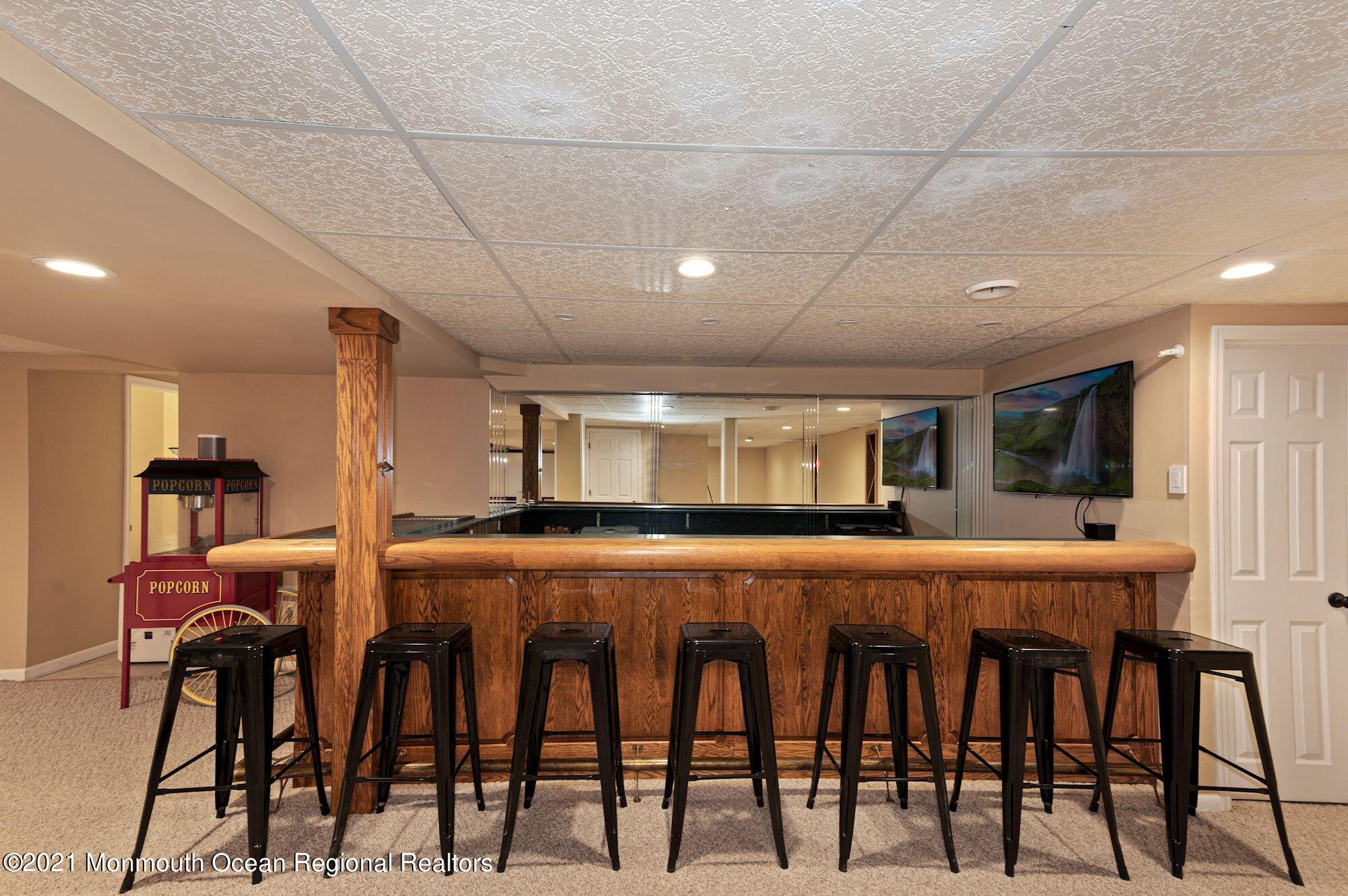 256 Nottingham Road Morganville, NJ 07751 - Photo 29 of 41 a dining hall with stainless steel appliances kitchen island a table and chairs