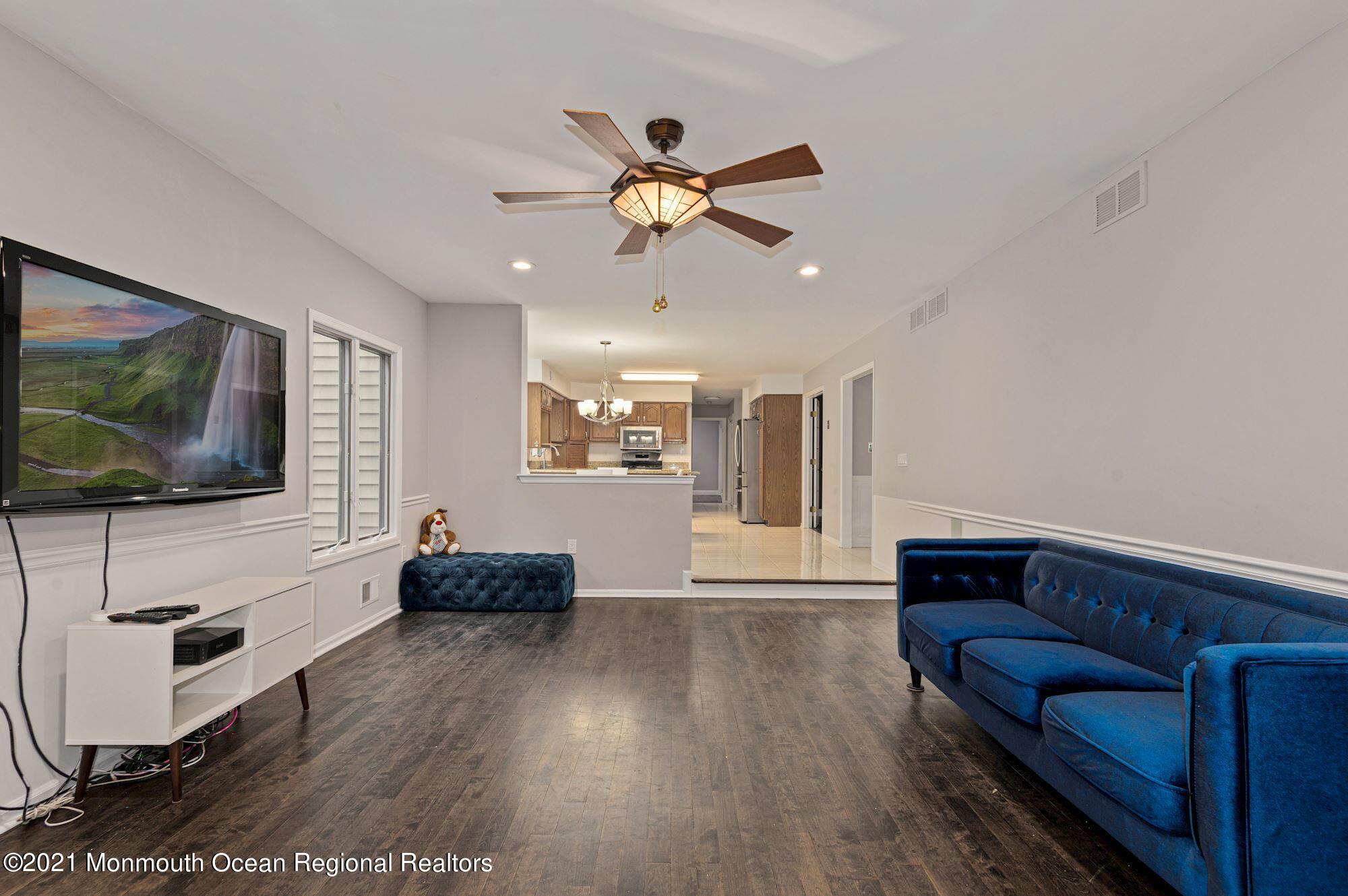 256 Nottingham Road Morganville, NJ 07751 - Photo 5 of 41 a living room with furniture and a flat screen tv