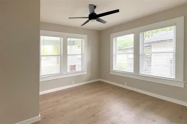 a view of an empty room with a window