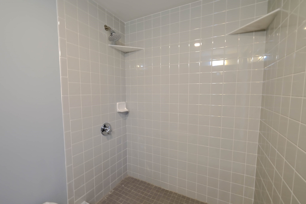 105 Clarendon Street, Unit 2 Fitchburg, MA 01420 - Photo 12 of 30 a bathroom with a shower