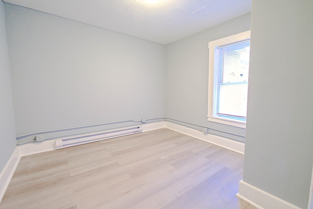 105 Clarendon Street, Unit 2 Fitchburg, MA 01420 - Photo 14 of 30 a view of an empty room with a window