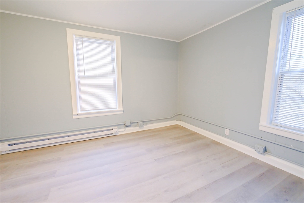 105 Clarendon Street, Unit 2 Fitchburg, MA 01420 - Photo 17 of 30 an empty room with a window