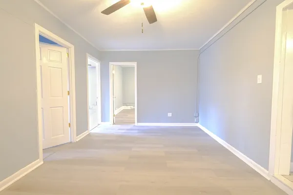 a view of an empty room with a window