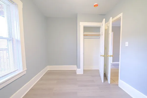 a view of an empty room and a window