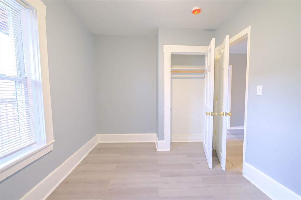 105 Clarendon Street, Unit 2 Fitchburg, MA 01420 - Photo 21 of 30 a view of an empty room and a window