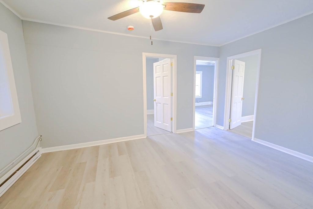 105 Clarendon Street, Unit 2 Fitchburg, MA 01420 - Photo 22 of 30 wooden floor in an empty room with a window