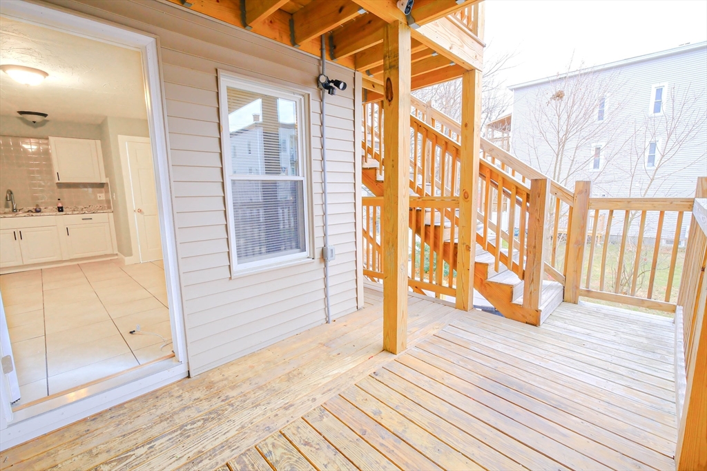 105 Clarendon Street, Unit 2 Fitchburg, MA 01420 - Photo 29 of 30 a view of a porch with wooden floor and furniture