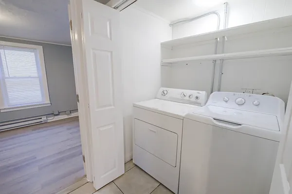 a utility room with dryer and washer