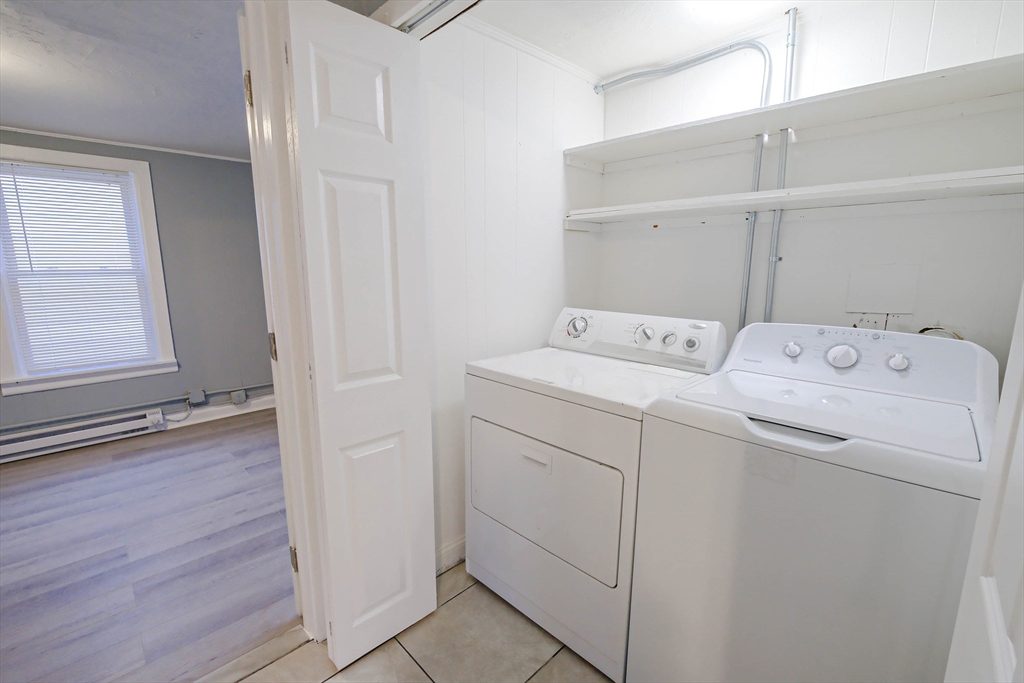 105 Clarendon Street, Unit 2 Fitchburg, MA 01420 - Photo 6 of 30 a utility room with dryer and washer