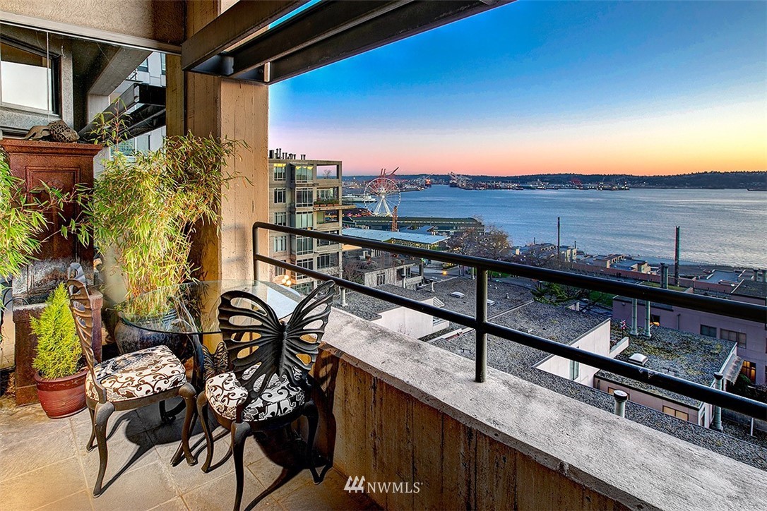 2021 1st Avenue, Unit E6 Seattle, WA 98121 - Photo 13 of 32 a view of a chairs and table in the balcony