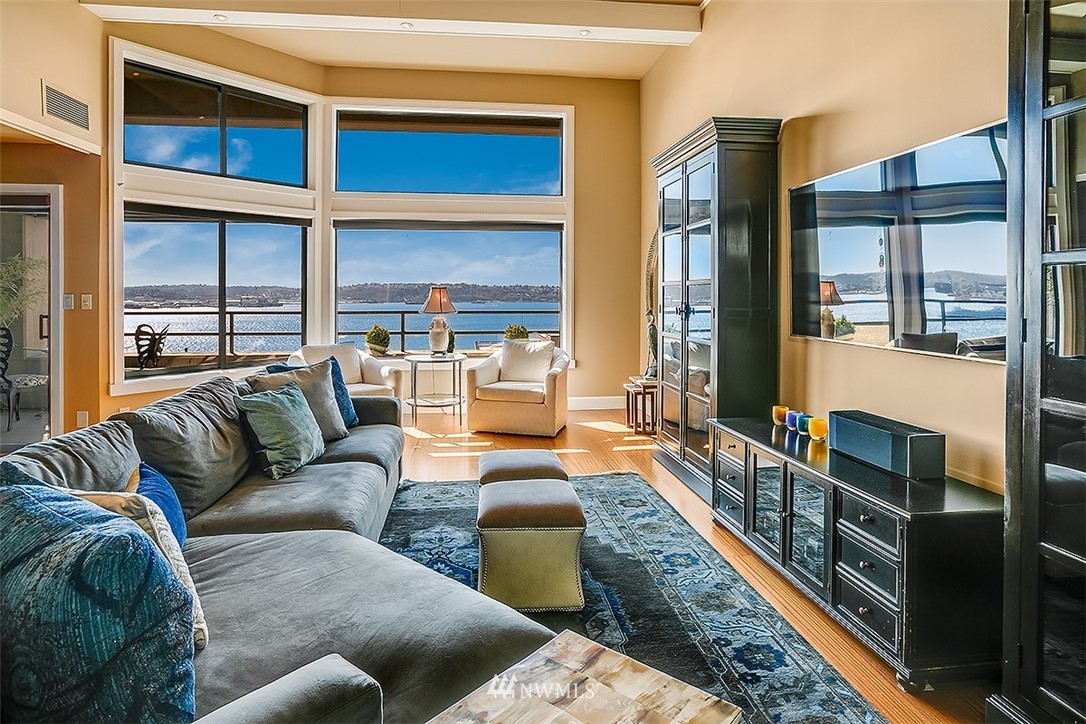 2021 1st Avenue, Unit E6 Seattle, WA 98121 - Photo 16 of 32 a living room with furniture fireplace and a large window