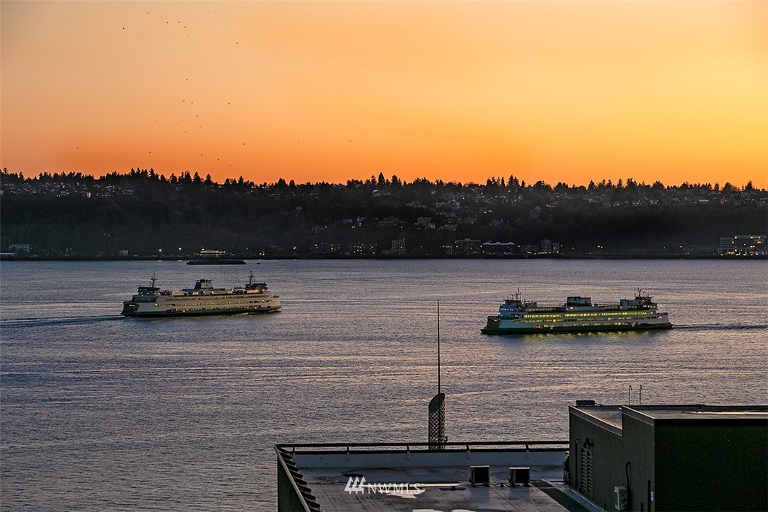 2021 1st Avenue, Unit E6 Seattle, WA 98121 - Photo 28 of 32 a view of a lake with houses