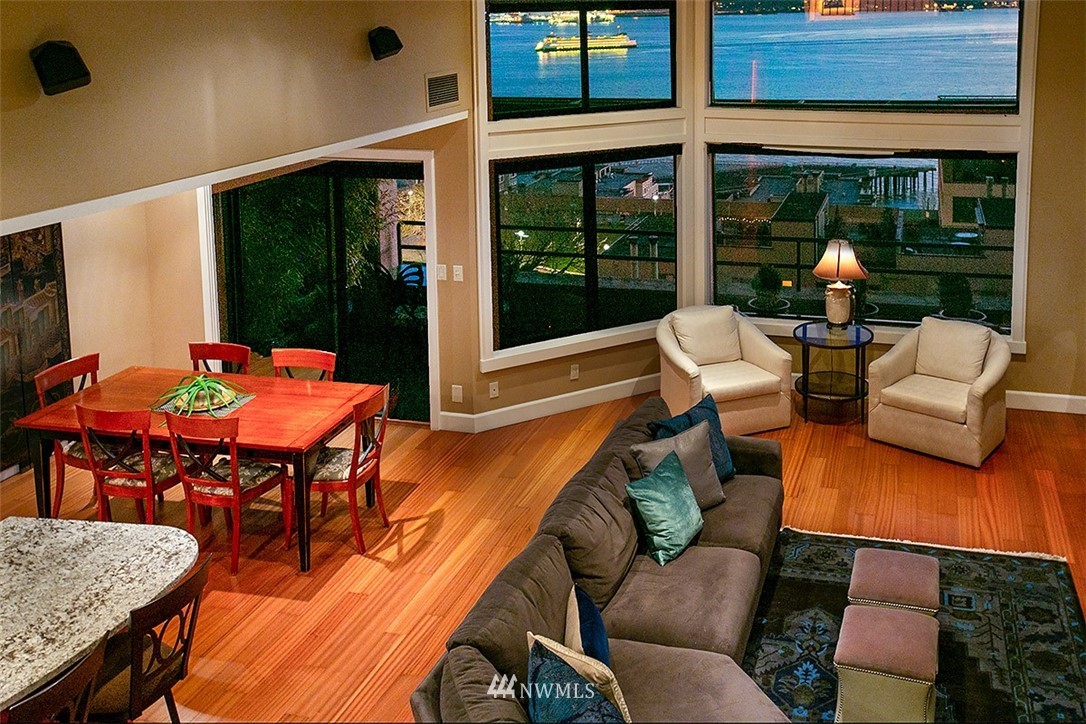 2021 1st Avenue, Unit E6 Seattle, WA 98121 - Photo 4 of 32 a living room with furniture and large windows