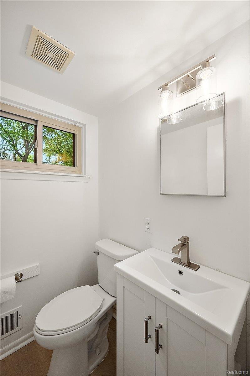 536 Rolling Rock Road Bloomfield Hills, MI 48304 - Photo 24 of 48 Half bathroom with vanity and toilet