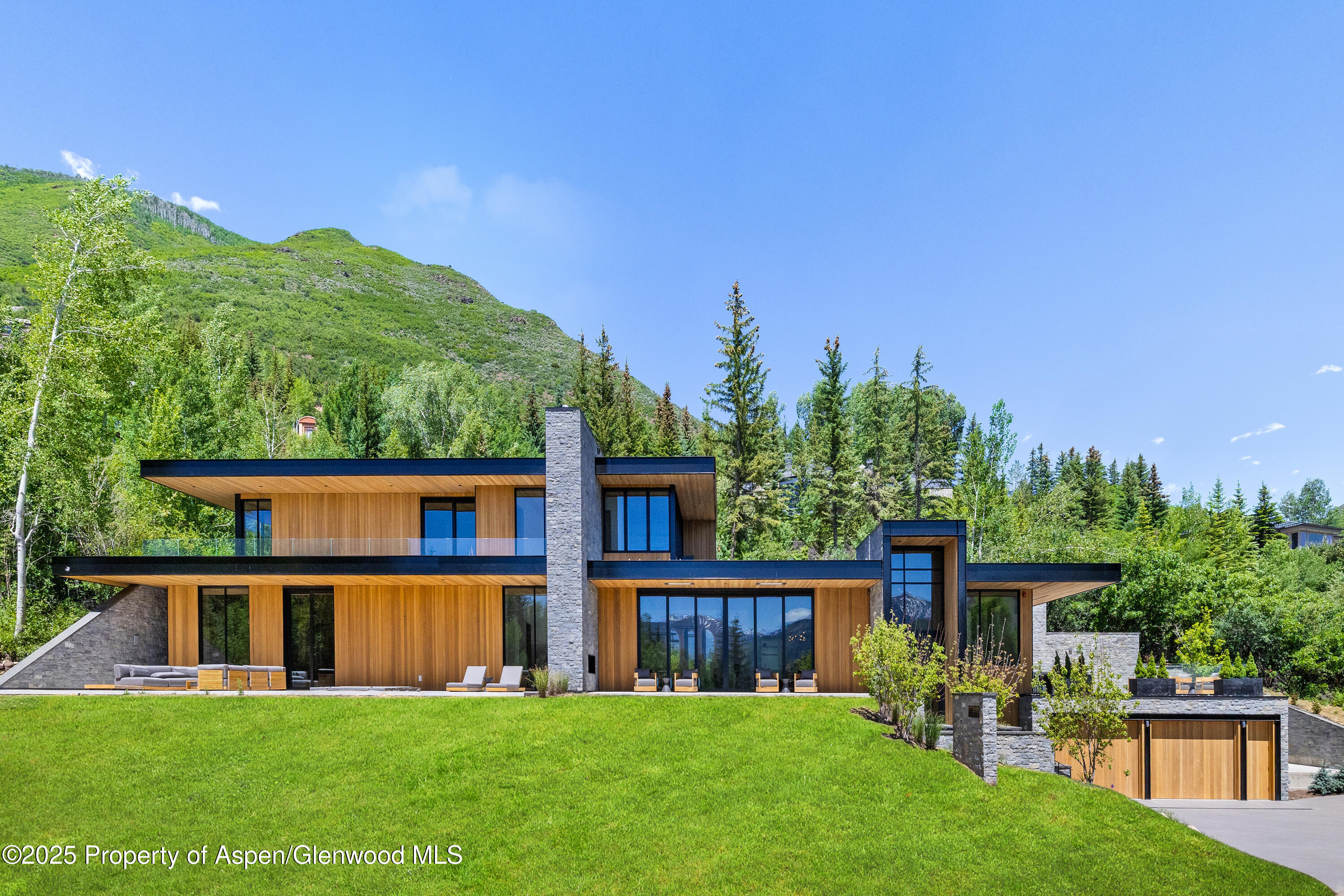 395 East Reds Road Aspen, CO 81612 - Photo 1 of 51 front view of a house with a yard