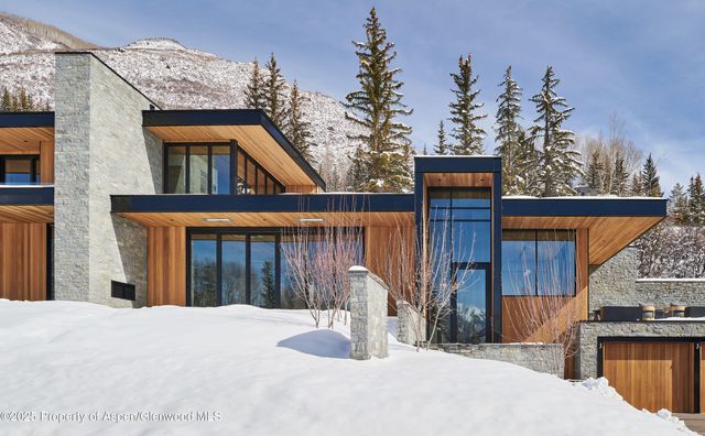 a bedroom with a bed next to a window with outer view