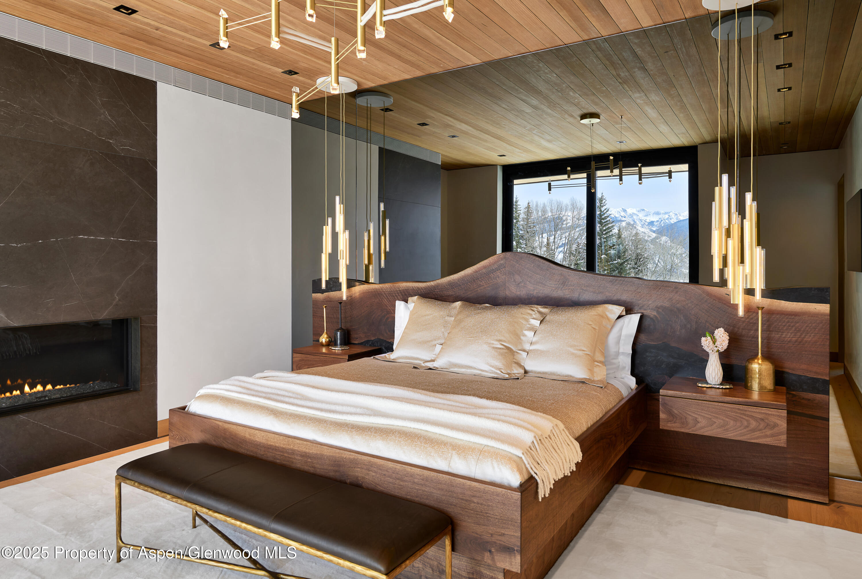 395 East Reds Road Aspen, CO 81612 - Photo 18 of 51 a bedroom with a bed next to a window with outer view