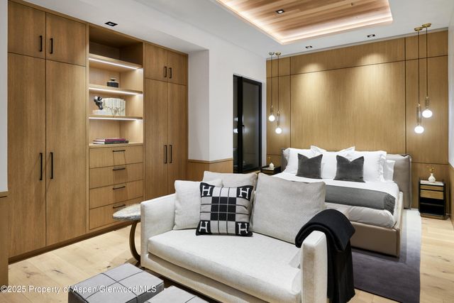 a room with a table chairs and wooden floor