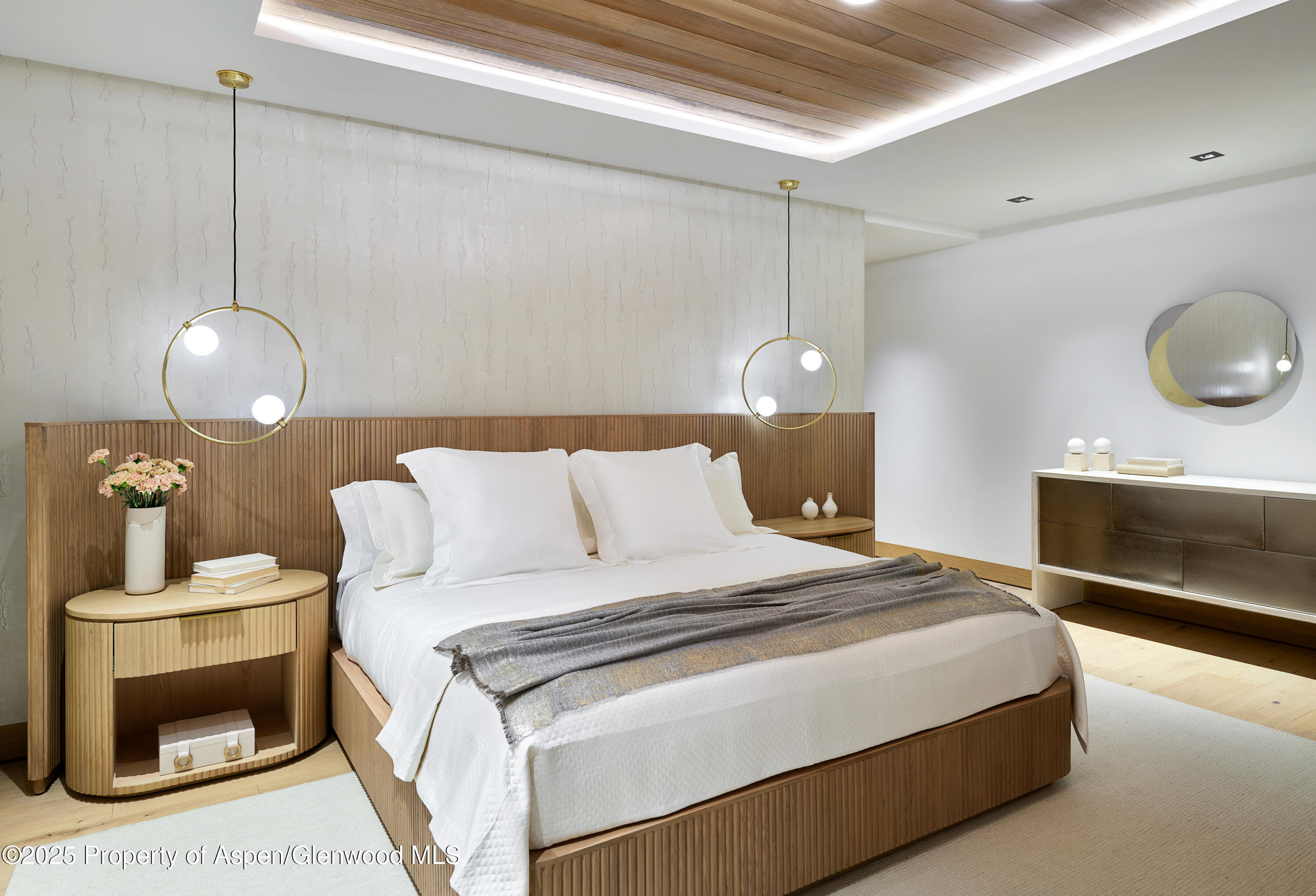 395 East Reds Road Aspen, CO 81612 - Photo 46 of 51 a bedroom with a bed and a chandelier