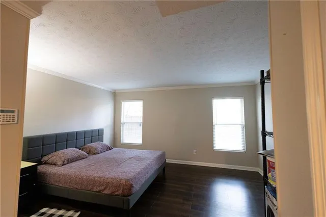 a view of a hallway with wooden floor and a fireplace