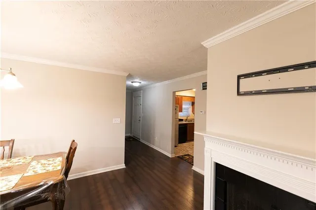 a view of a dining room with furniture wooden floor and chandelier