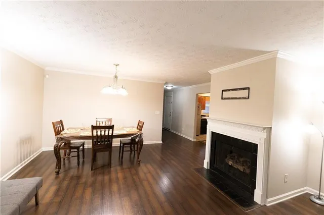 a view of a livingroom with furniture and a flat screen tv