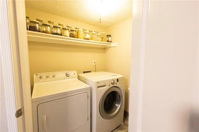 a view of hallway with furniture and wooden floor