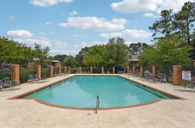 a view of a swimming pool with a patio