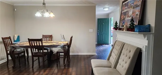 a view of a livingroom with furniture and a fireplace