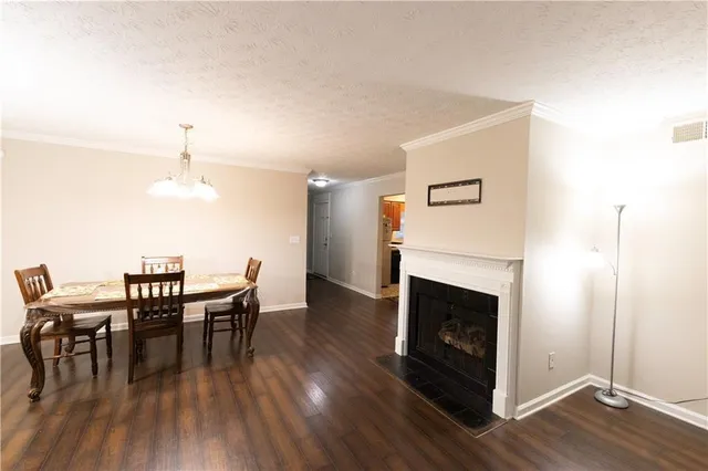 a view of a bedroom with wooden floor and closet