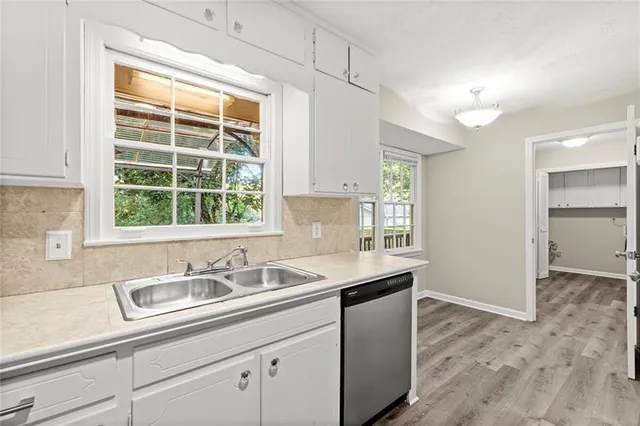 a kitchen with a sink and a window