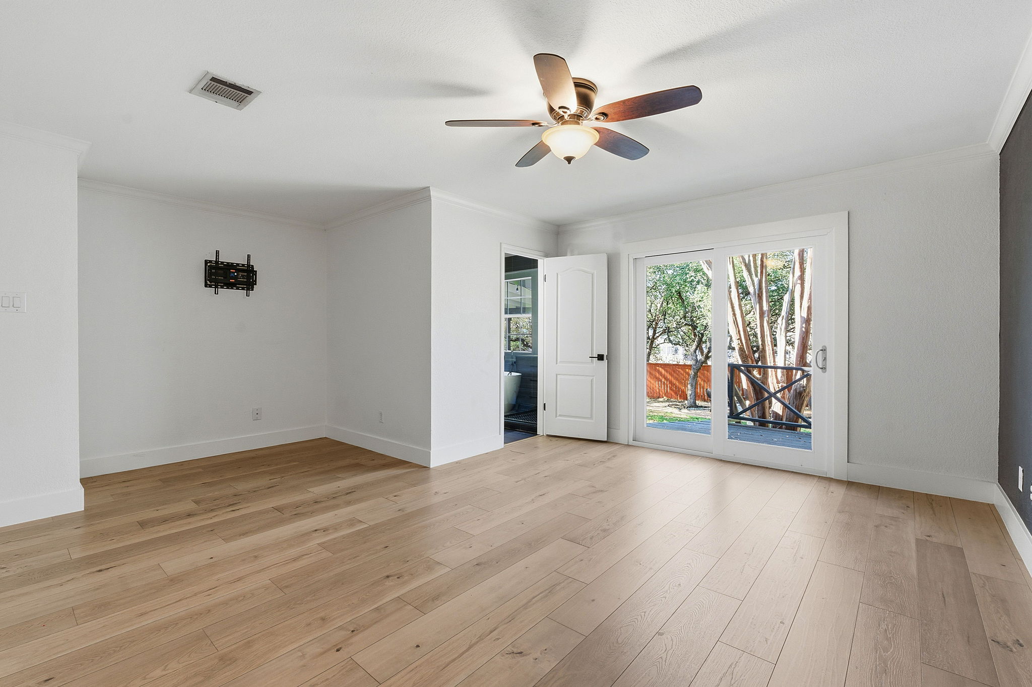 1511 Knoll Ridge Drive Cedar Park, TX 78613 - Photo 13 of 26 Unfurnished room featuring ornamental molding, a ceiling fan, and light wood-style flooring