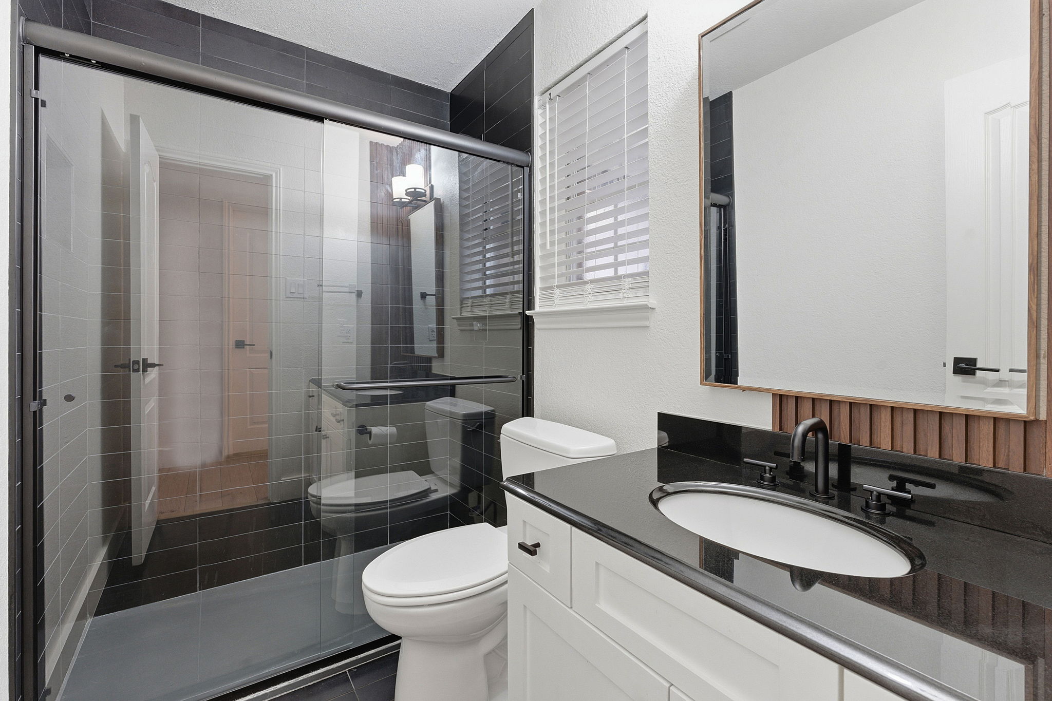 1511 Knoll Ridge Drive Cedar Park, TX 78613 - Photo 20 of 26 Full bathroom with vanity, a shower stall, and a textured wall
