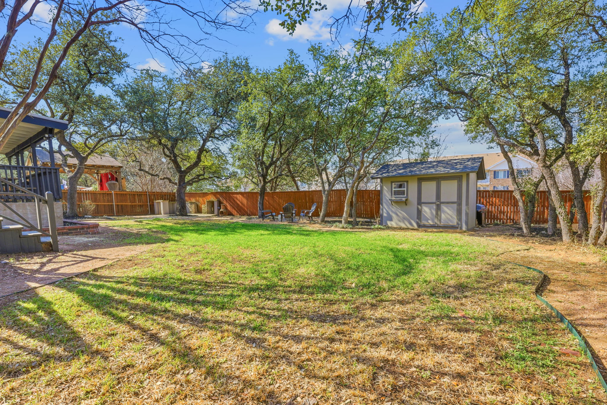 1511 Knoll Ridge Drive Cedar Park, TX 78613 - Photo 23 of 26 Fenced backyard with a storage unit