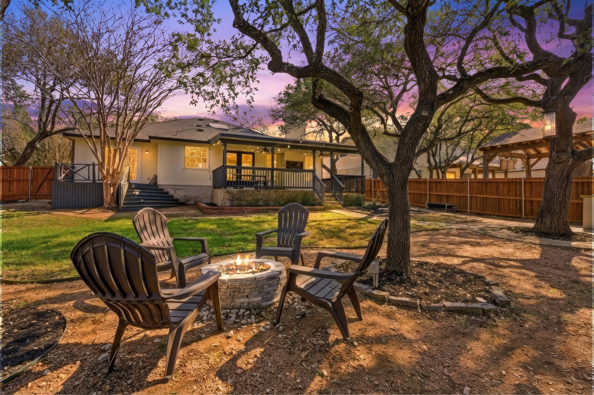 1511 Knoll Ridge Drive Cedar Park, TX 78613 - Photo 3 of 26 Yard at dusk featuring a patio area, a fenced backyard, and a fire pit