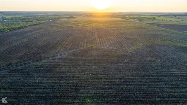 a view of an ocean next to a big yard