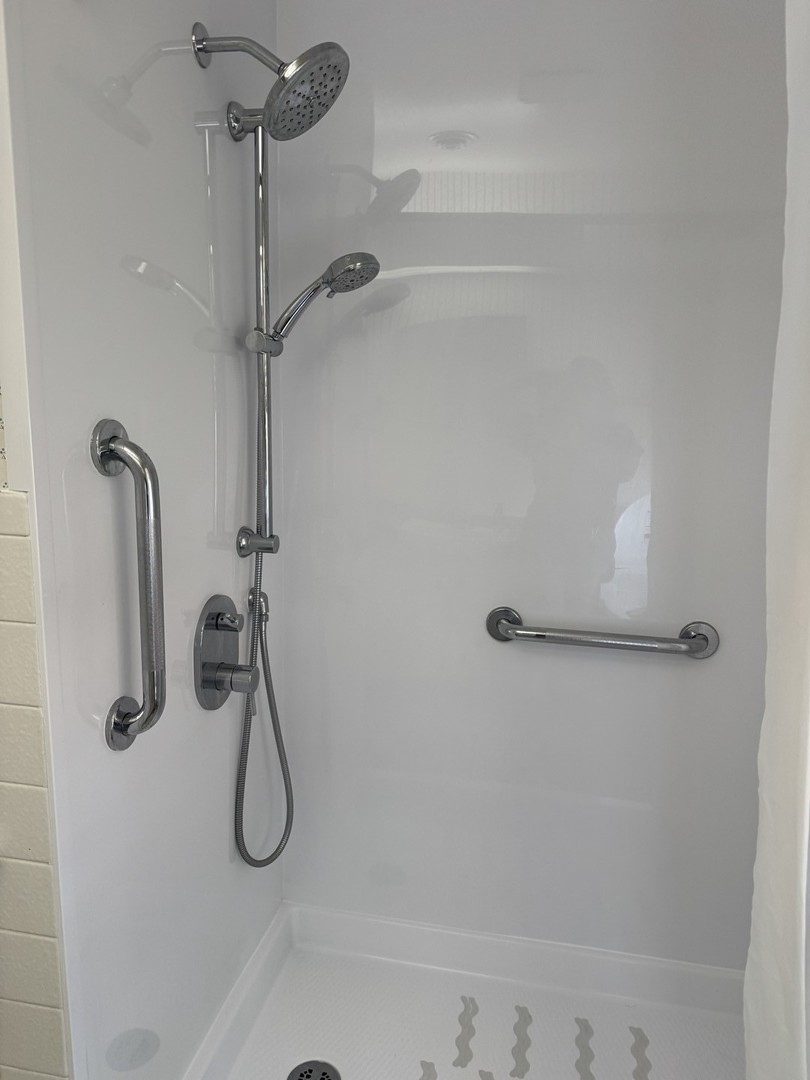 700 Garfield Road Harvard, IL 60033 - Photo 14 of 37 a bathroom with a shower