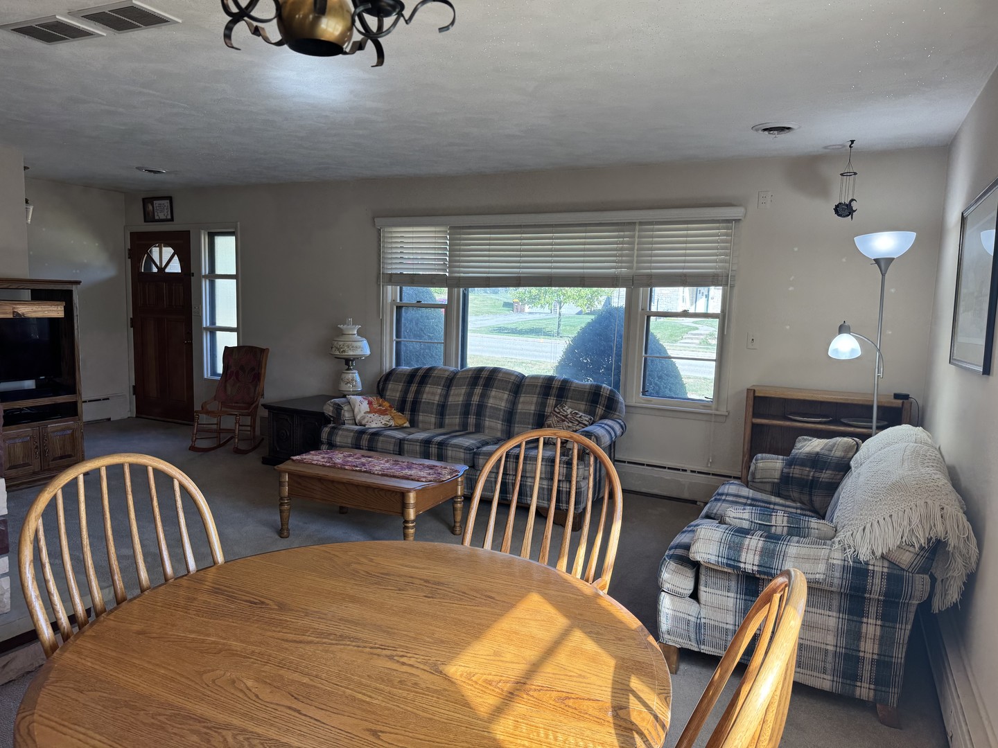 700 Garfield Road Harvard, IL 60033 - Photo 18 of 37 a view of a dining room with furniture and a large window