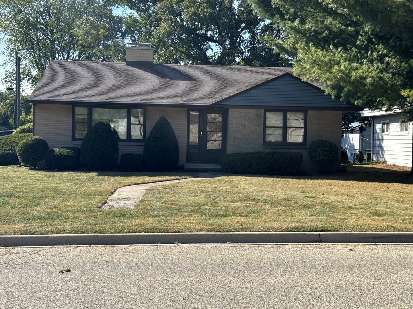 700 Garfield Road Harvard, IL 60033 - Photo 2 of 37 a front view of a house with a yard
