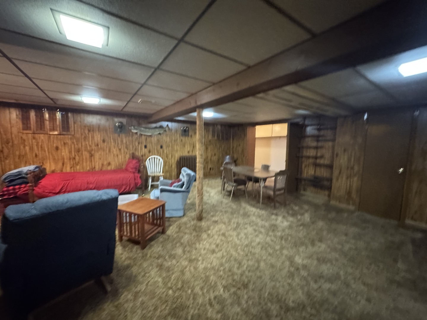 700 Garfield Road Harvard, IL 60033 - Photo 30 of 37 a room with furniture and a projector