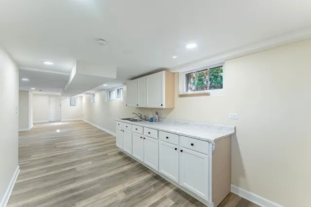 a kitchen with granite countertop a stove and a sink