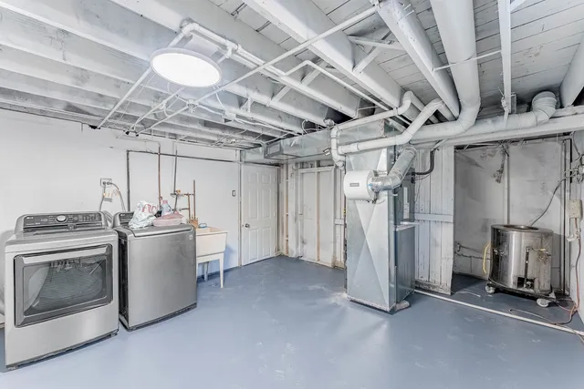 a view of a storage & utility room with a kitchen