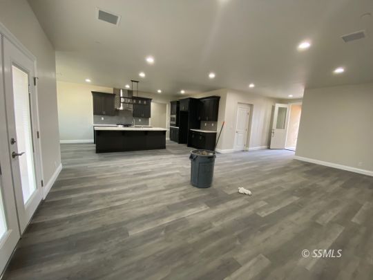 1101 Via Flore Way Ridgecrest, CA 93555 - Photo 7 of 8 a view of kitchen with refrigerator and microwave