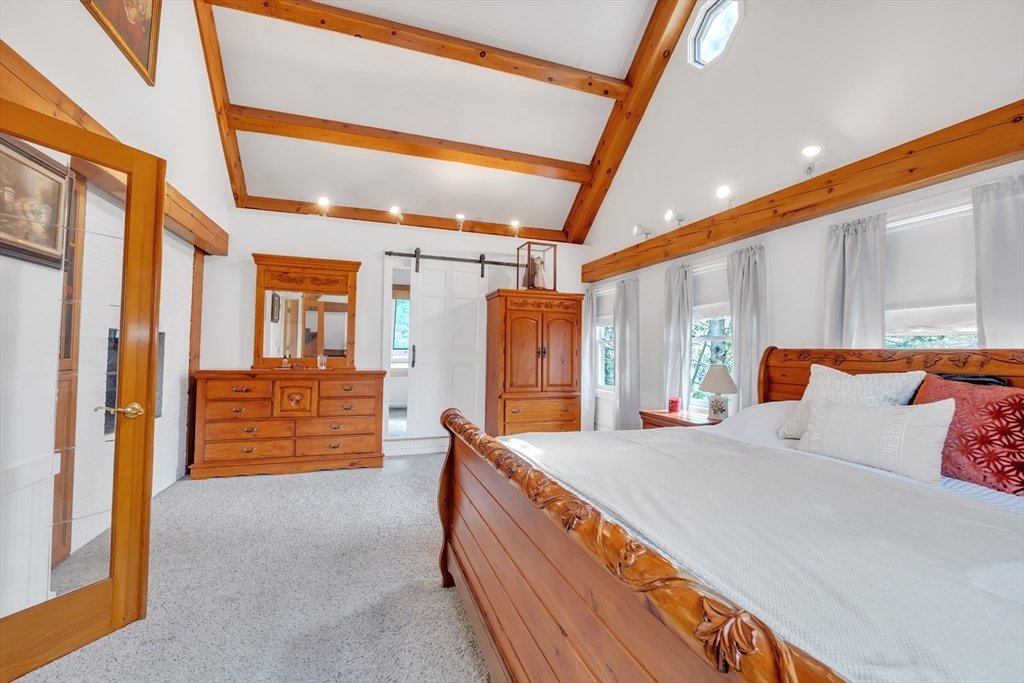 89 Kittery Avenue Rowley, MA 01969 - Photo 16 of 37 a bed room with a bed and a walk in closet